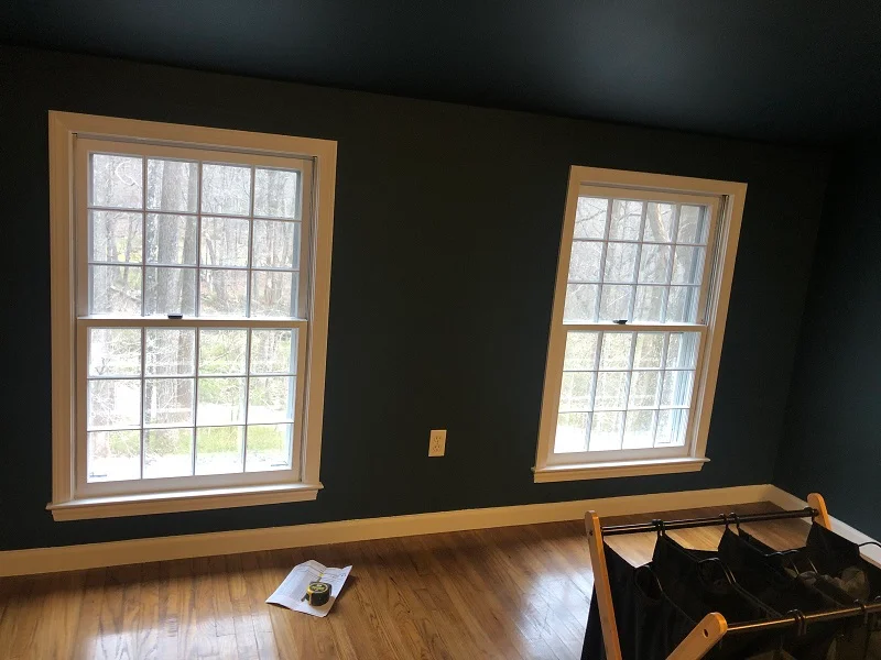 All wood single pane double hung windows with poor energy efficiency